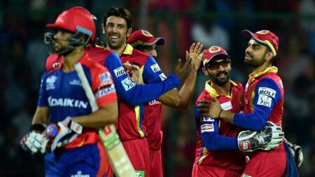 Royal Challengers Bangalore`s captain Virat Kohli celebrate with teammates after the dismissal of Delhi Daredevils captain J P Duminy