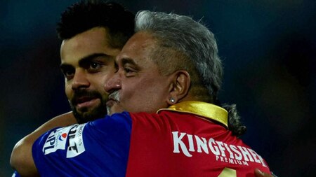 Royal Challengers Bangalore`s captain virat Kohli celebrates with team owner Vijay Mallya after win over Delhi Daredevils during an IPL match at Feroz Shah Kotla Stadium in New Delhi on Sunday.