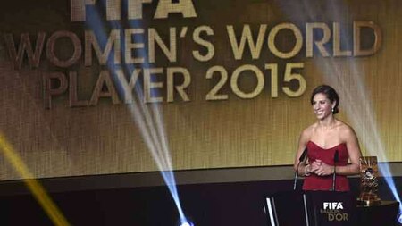 Carli Lloyd poses after receiving the award