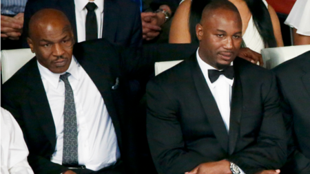 Former heavyweight boxers Mike Tyson (L) and Lennox Lewis