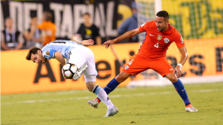 Mauricio Isla tackling Messi