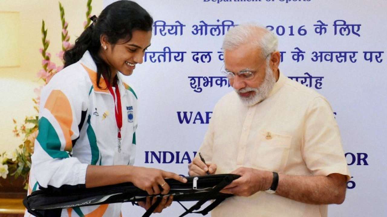 Modi signs PV Sindhu's racket