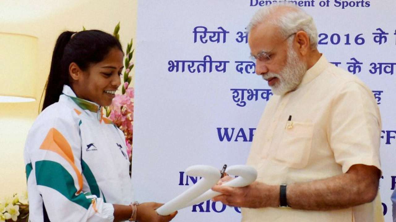 Hockey player Deepika Thakur getting her hockey stick autographed