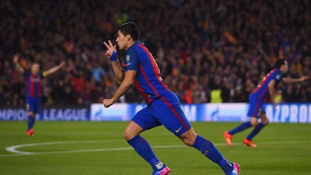 Luis Suarez celebrates in his trademark style