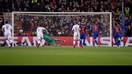 Lionel Messi scores Barcelona's third goal from the spot