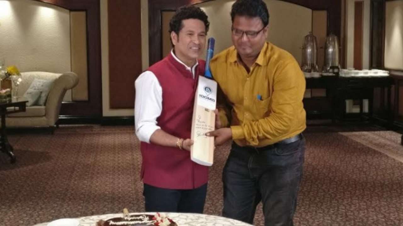 Sachin Tendulkar cuts a cake on his 40th birthday, as his wife Anjali looks  on | ESPNcricinfo.com