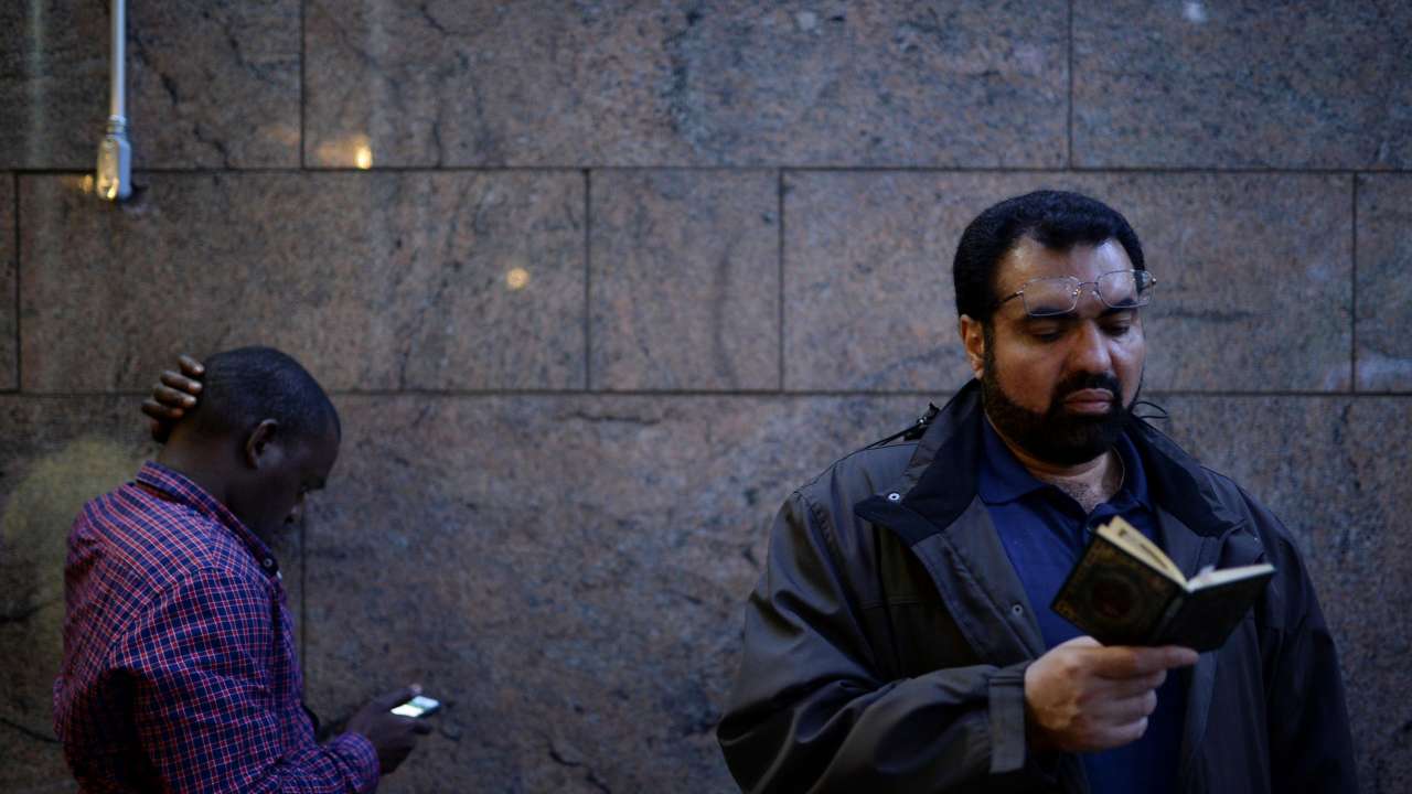 A Muslim American man recites the Quran
