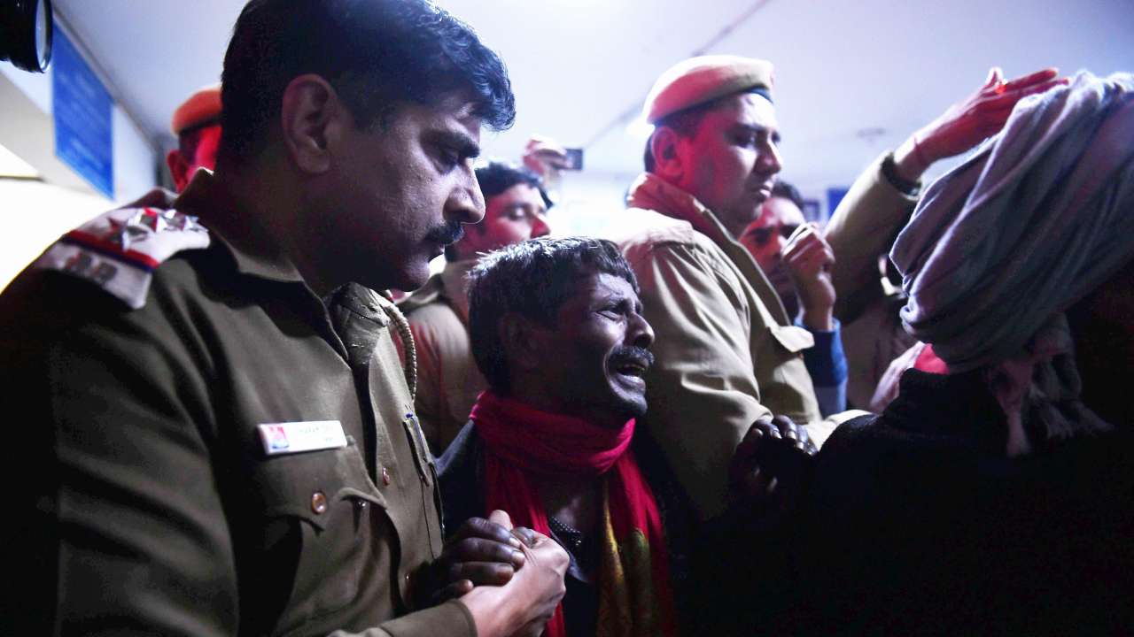 Delhi fire victims' families grieve the dead