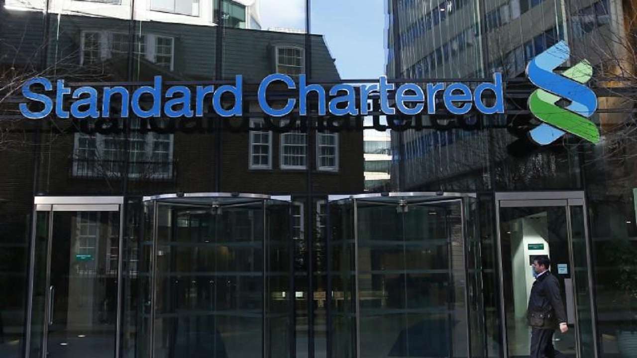 Standard Chartered brings back dividends as profits jump