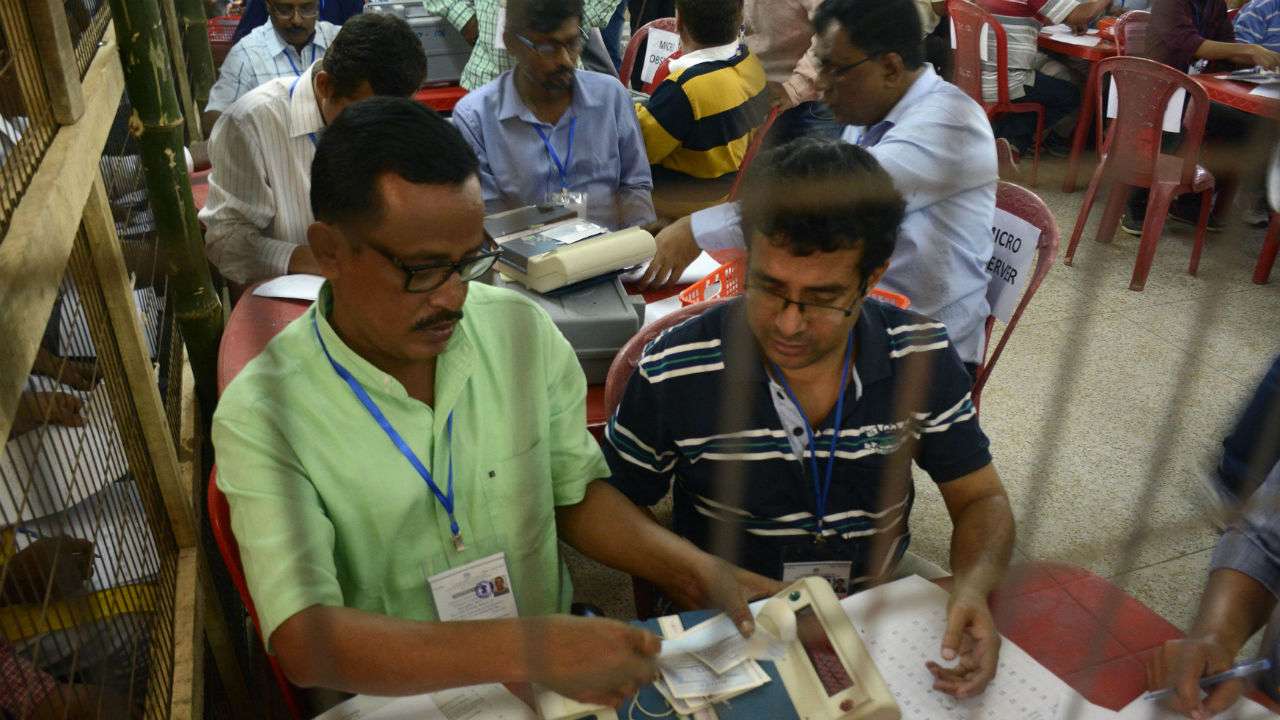 Indian election officials tally votes