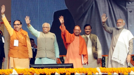 PM Narendra Modi, UP CM Yogi Adityanath, UP Governor Ram Naik wave to the crowd