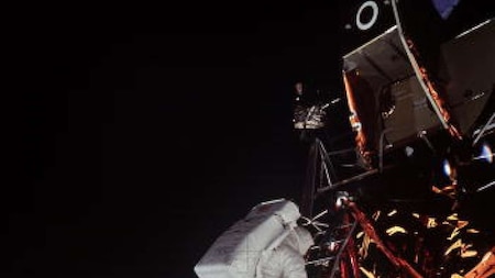 Astronaut Edwin 'Buzz' Aldrin getting down from the Lunar Module ladder