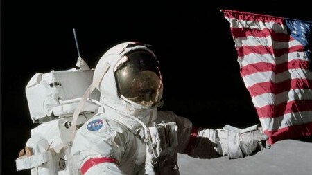 Eugene Cernan holds US flag on Moon