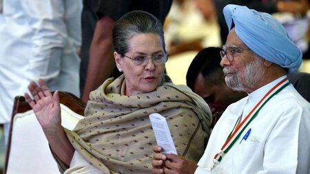 Sonia Gandhi speaks with former Prime Minister Manmohan Singh