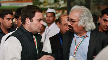 Congress President Rahul Gandhi talks with Sam Pitroda