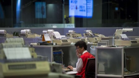 A floor trader reacts inside the trading hall