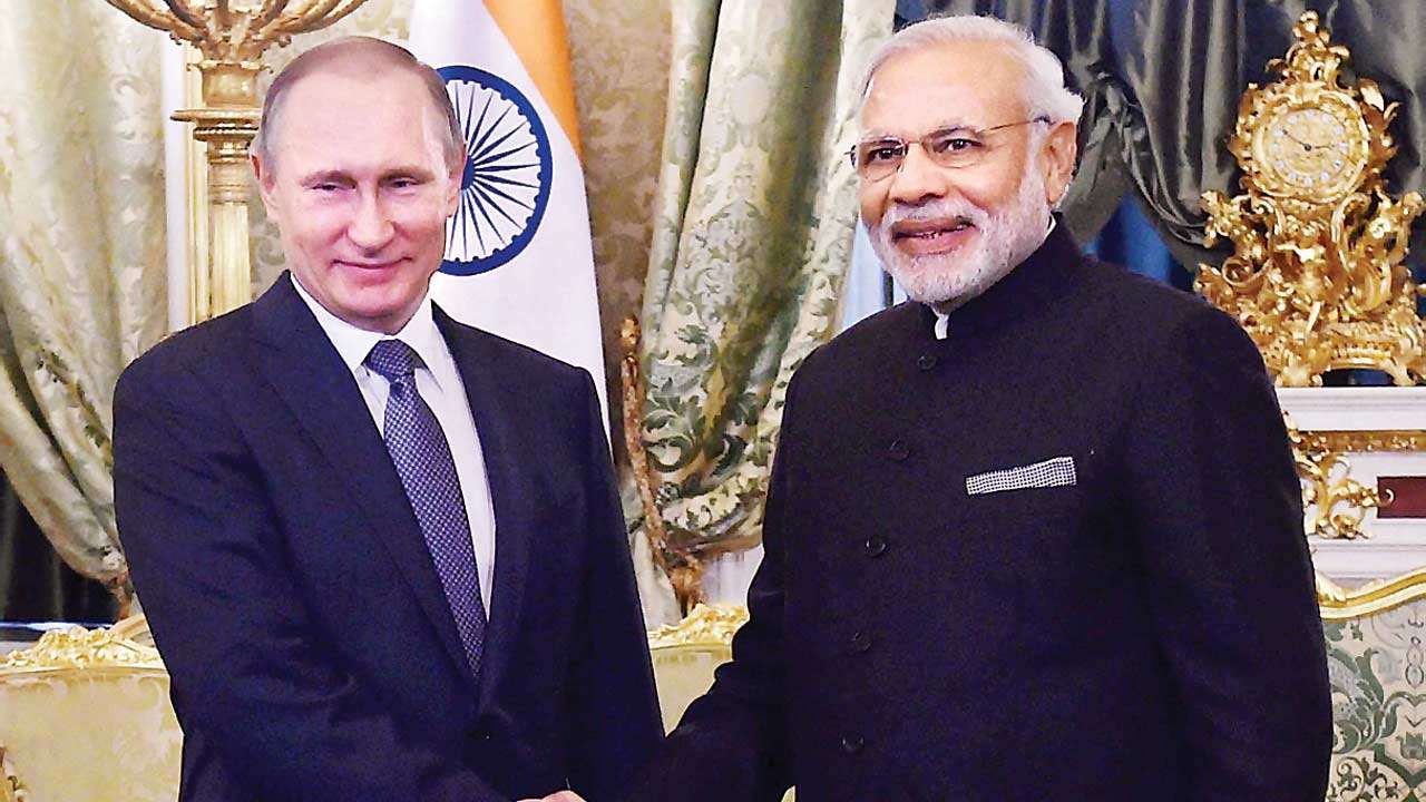 PM Modi shakes hands with Russian President Vladimir Putin in Moscow