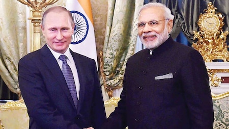 PM Modi shakes hands with Russian President Vladimir Putin in Moscow