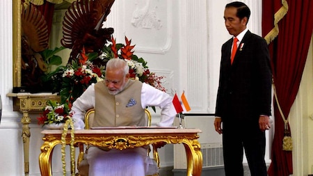 Indias Prime Minister Narendra Modi takes a seat