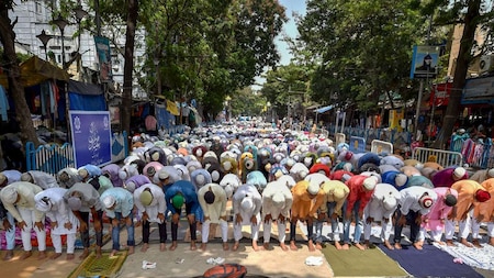 Muslims offer Friday prayers during the holy month of Ramadan in front of a mosque