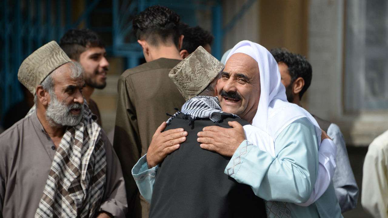 Muslims hug each other