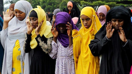 Muslims attend Eid al-Fitr prayers