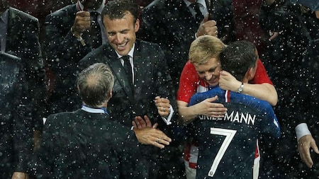 Macron greets Frances coach Didier Deschamps, Kolinda Grabar-Kitarovic hugs Antoine Griezmann