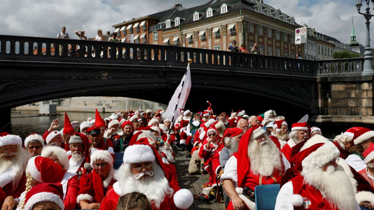 Santas take a boat ride