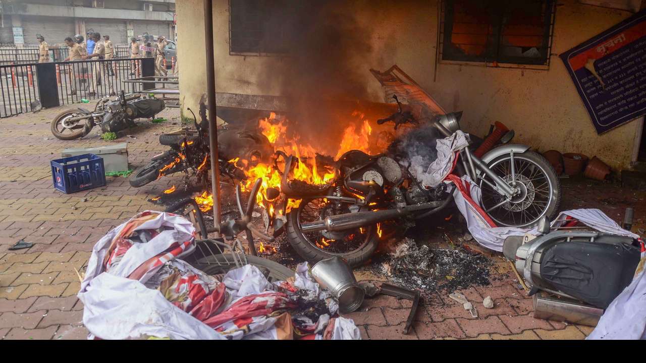 Flames rise from burning vehicles