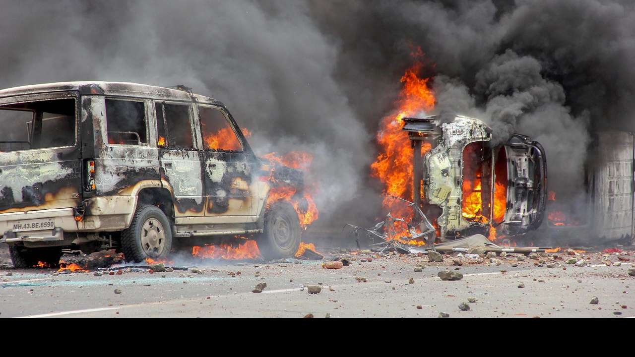Flames rise from a burning vehicle