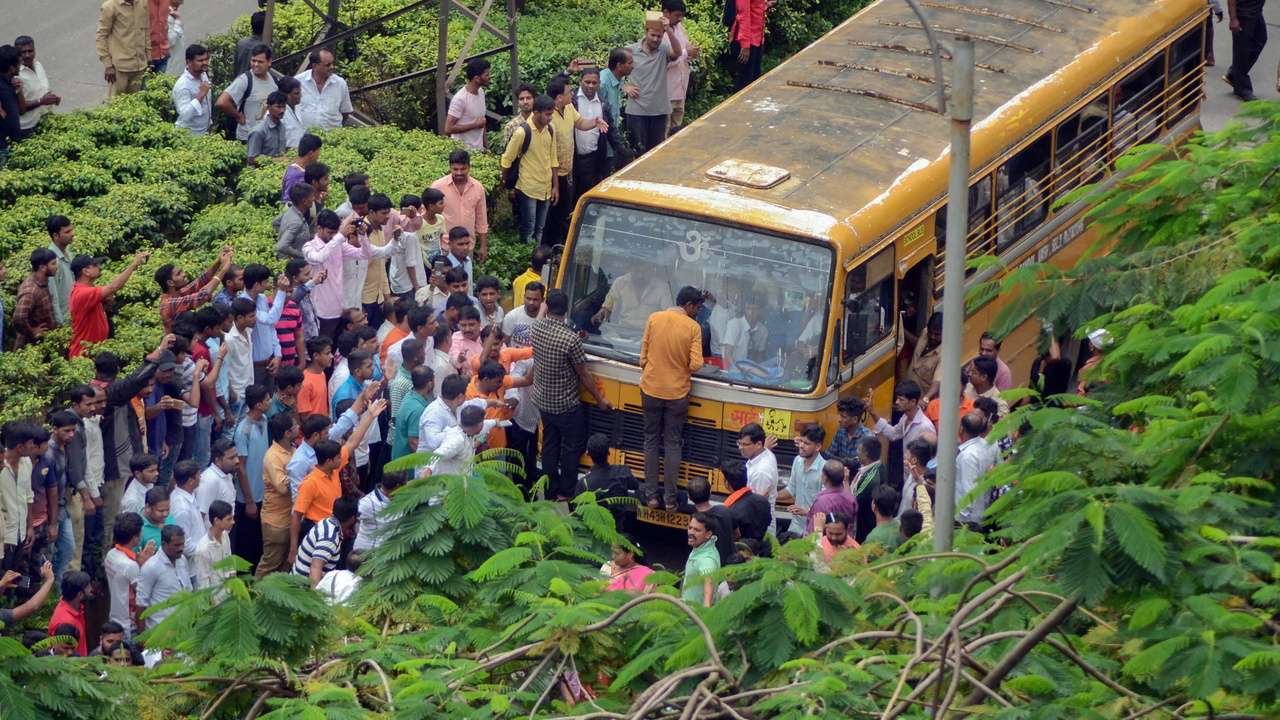 Protesters stop a school bus