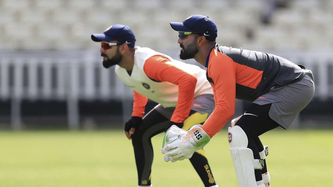 Kohli getting used to standing beside DK!