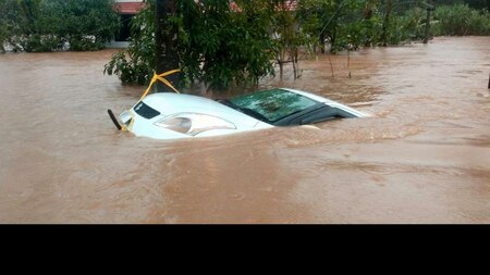 Car is seen submerged in flood water