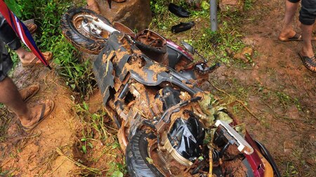 Mud-smeared motorcycle following a landslide