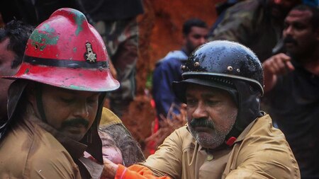 Fire Services personnel rescue a child