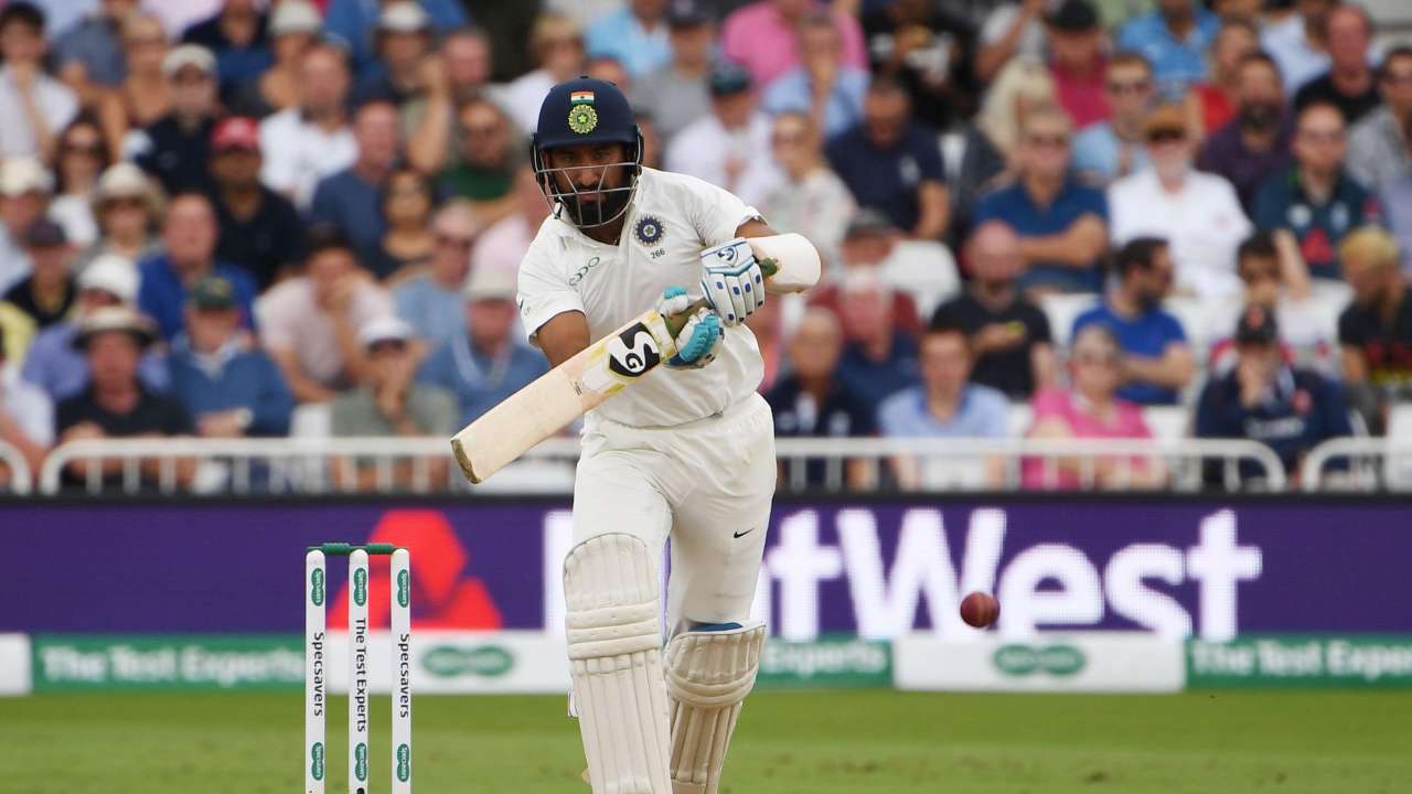 Pujara gets to 50