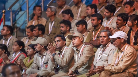 Postal staff look on during the launch of India Post Payments Bank (IPPB), in New Delhi on Saturday