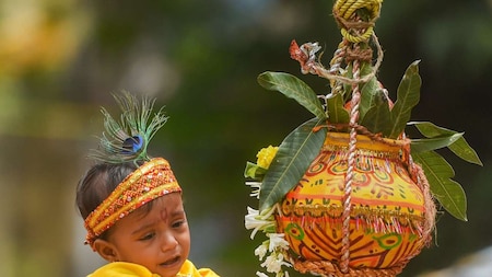 Child dressed as Lord Krishna breaks 'Dahi Handi'