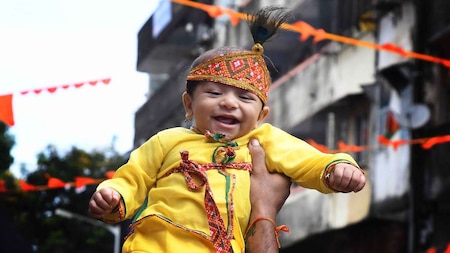Infant dressed as Bal Krishna