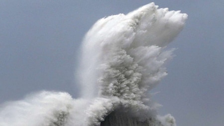 High waves hit breakwaters at a port