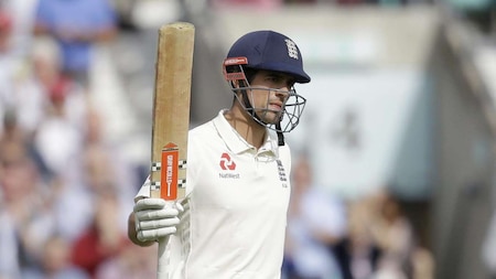 Cook completes century