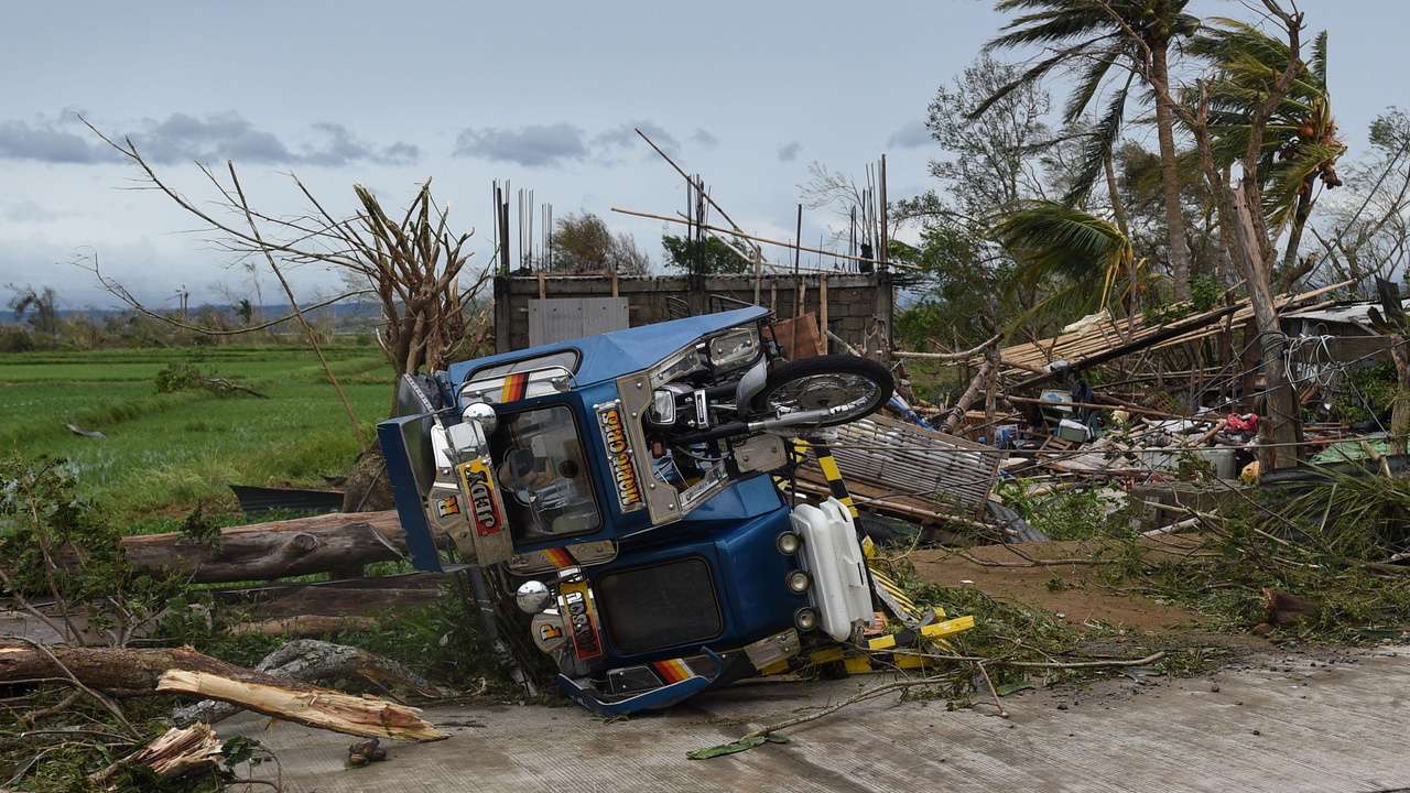 Three killed as Philippines warns of hazards in powerful typhoon's wake