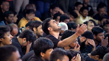 Muslim men mourners cry during Ashur