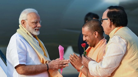 UP's CM Yogi Adityanath receives PM Modi on his arrival in Varanasi