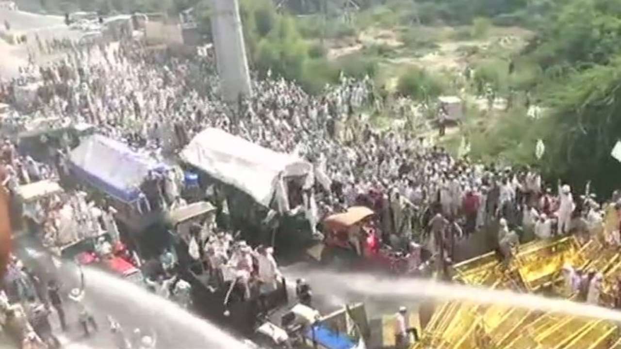 Police use water cannons to disperse protesters