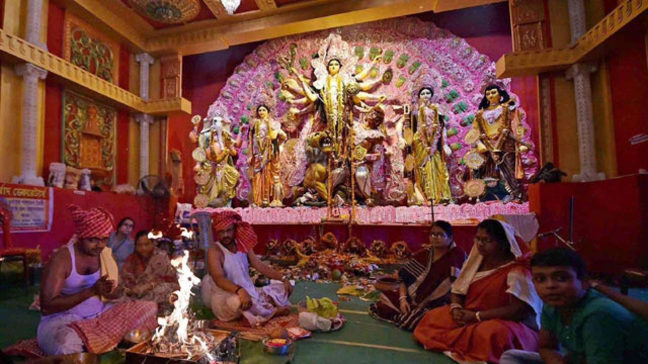 Recite the mantras and slokas of Maa every available minute with you.