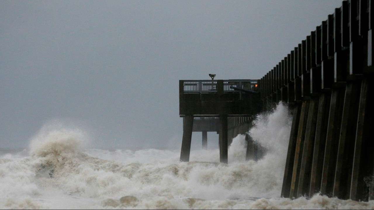  Waves crash along a pier as Hurricane Michael approaches Panama City Beach, Florida, 