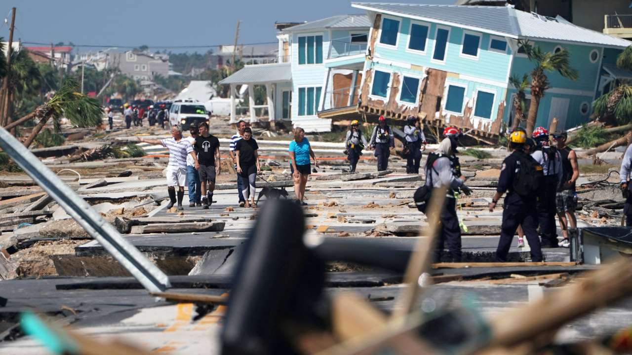 Residents walk along the main street