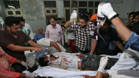 Hospital staff move a stretcher