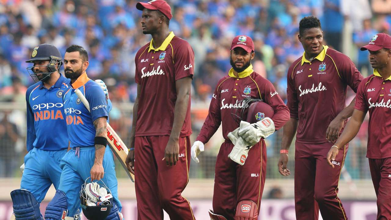 Kohli and Rohit walk back alongside West Indies players after India's victory on Thursday